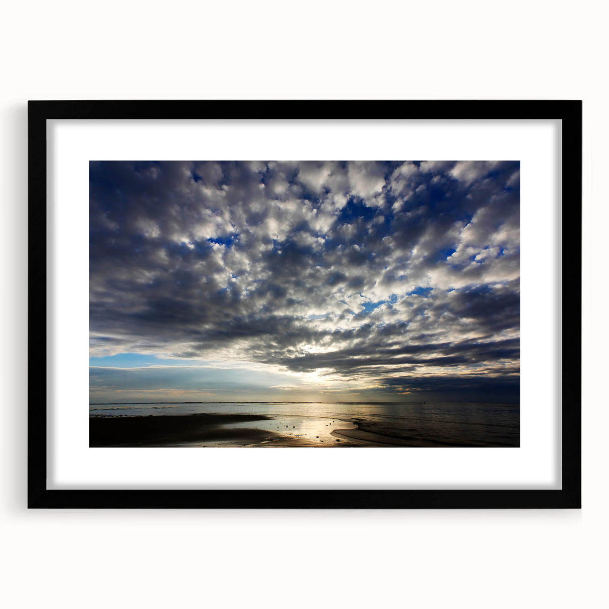 Framed landscape wall art print showcasing vibrant blue skies and lush green fields, featuring a sleek black frame and mat. Ideal for home decor enhancement.