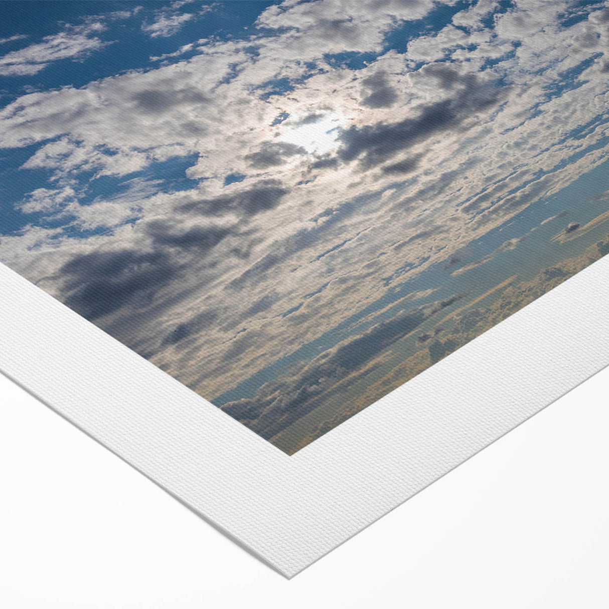 Rolled canvas artwork showcasing a vibrant landscape with soft pastel skies, ideal for home decor. The art piece emphasizes serene colors and natural beauty.