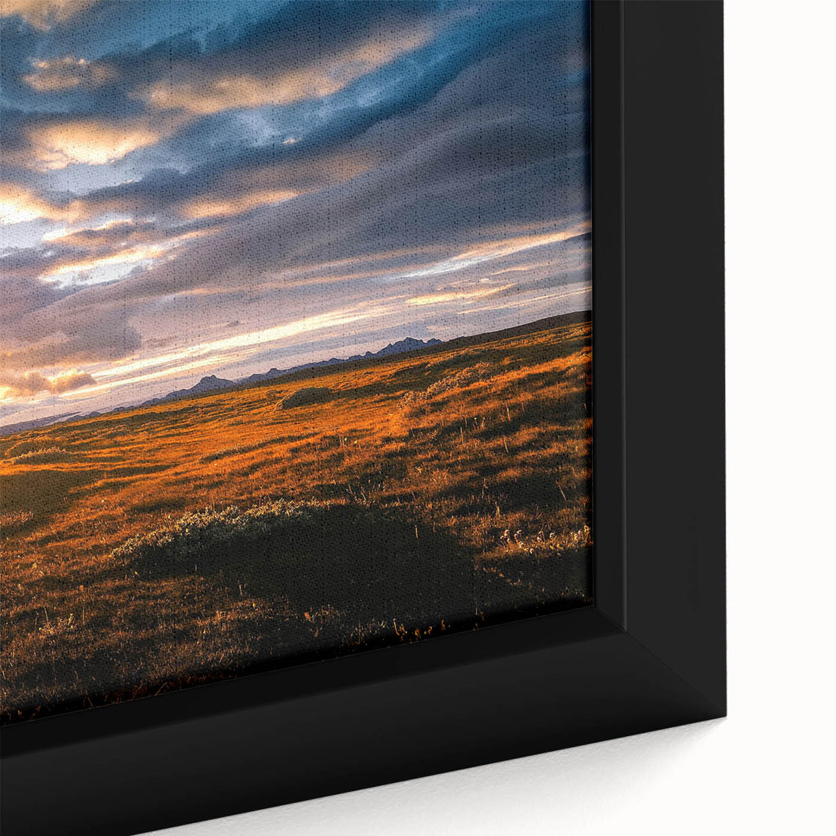 Framed canvas artwork showcasing a vibrant landscape with dramatic skies, featuring rich colors and intricate details, perfect for home decor enhancement.