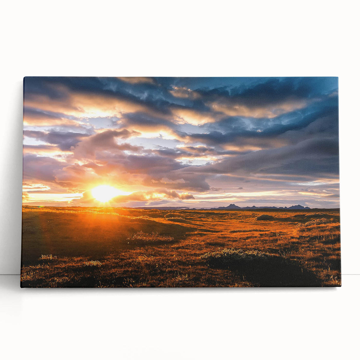 Abstract landscape wall art collection featuring a variety of colorful skyscapes on stretched canvas, elegantly leaning against a wall, enhancing modern decor.