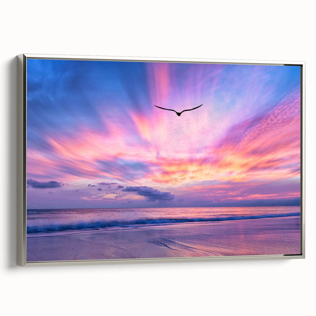 Framed canvas wall art showcasing a serene landscape with vibrant blue skies and lush green fields, highlighted by a sleek silver frame, ideal for modern decor.
