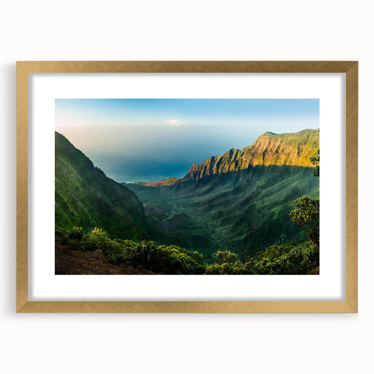 Framed wall art featuring a serene valley landscape design with a gold mat and frame, ideal for enhancing home decor with nature-inspired elegance.