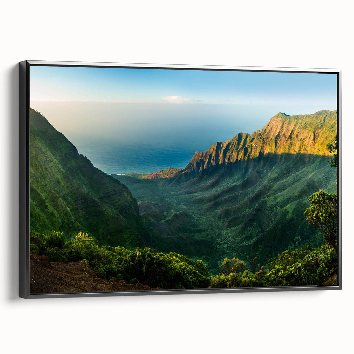 Framed canvas wall art showcasing a serene valley landscape design, featuring vibrant colors and intricate details, viewed from the side against a white background.