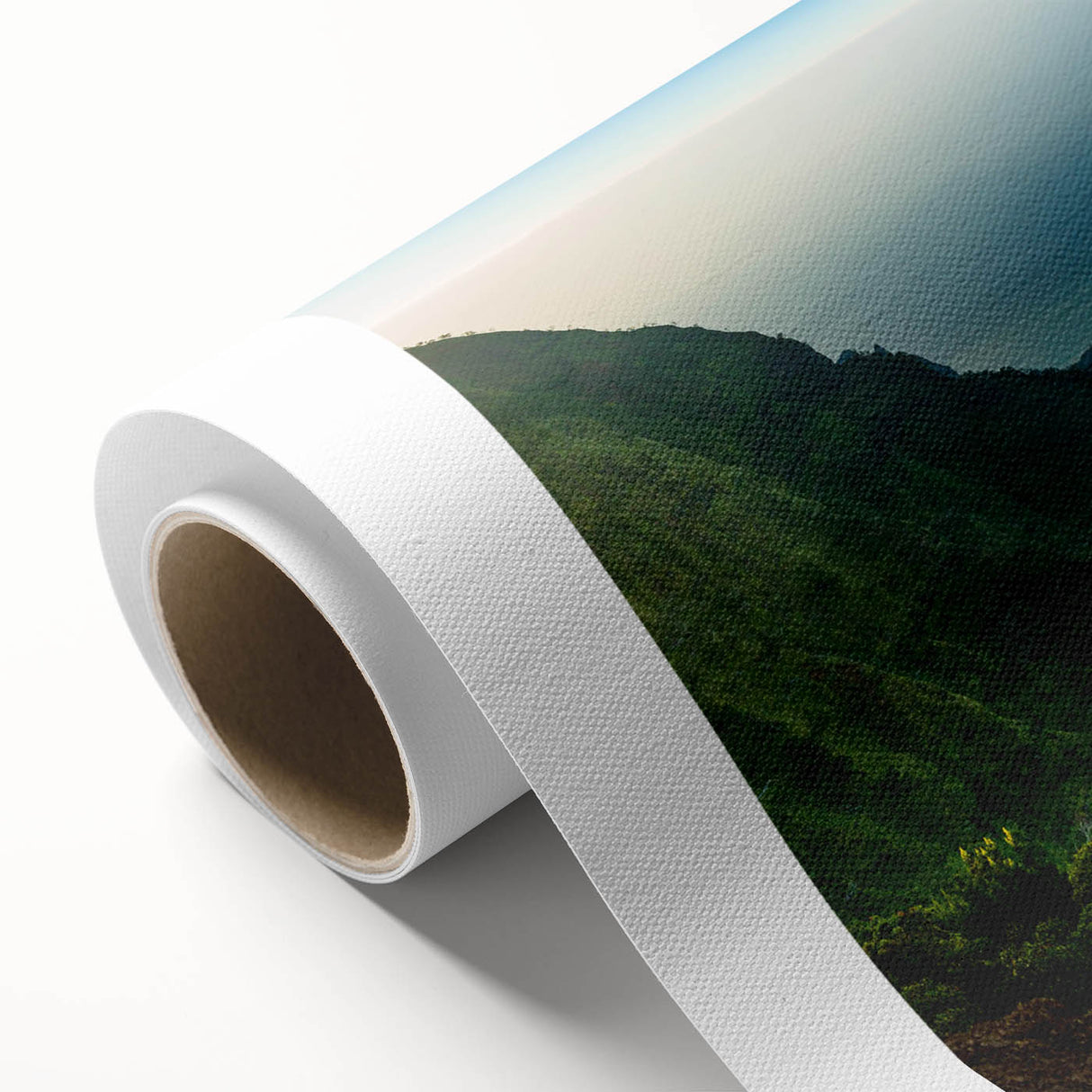 Rolled canvas showcasing a vibrant landscape design with lush green valleys and blue skies, perfect for adding a serene touch to modern home decor.