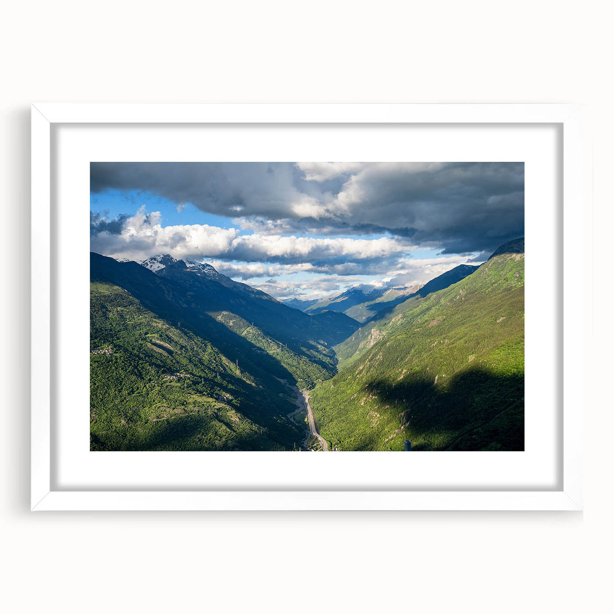 Framed landscape wall art collection featuring a serene valley design in soft earth tones, set against a white mat, enhancing any modern decor.