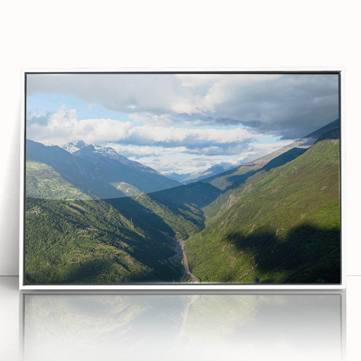 Framed acrylic wall art featuring a serene valley landscape design, showcasing vibrant greens and soft blues, perfect for modern home decor.