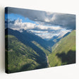 Stretched canvas wall art showcasing a serene valley landscape design, featuring vibrant greens and soft blues, ideal for home decor and relaxation.