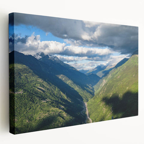 Stretched canvas wall art showcasing a serene valley landscape design, featuring vibrant greens and soft blues, ideal for home decor and relaxation.