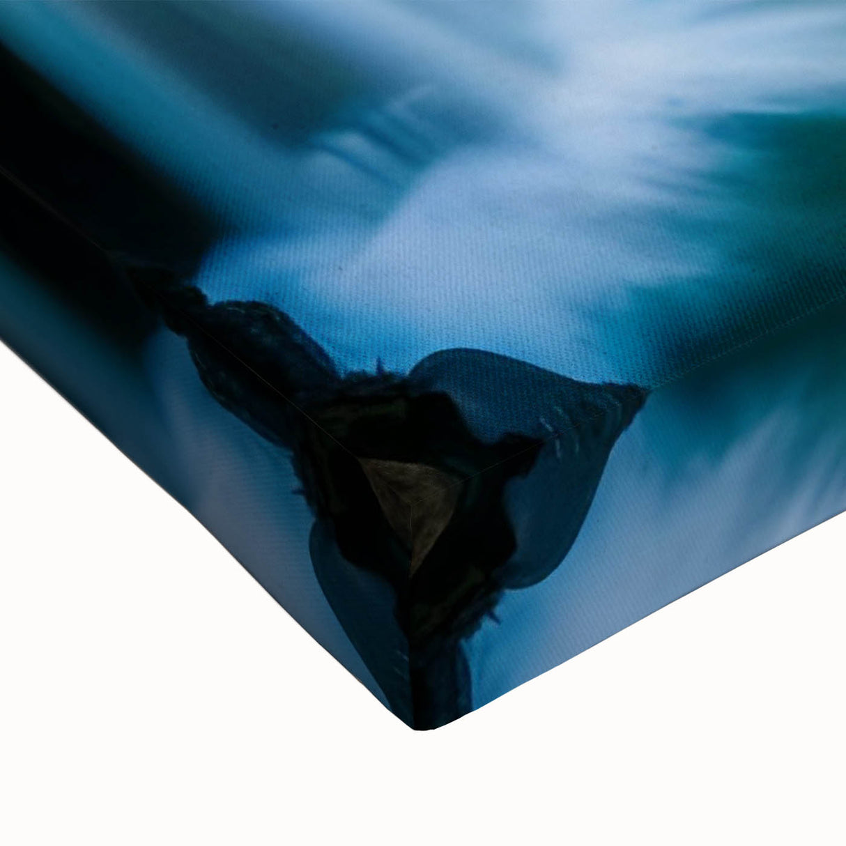 Close-up of a vibrant stretched canvas wall art featuring a serene waterfall landscape design, showcasing rich blue and green hues, perfect for home decor.