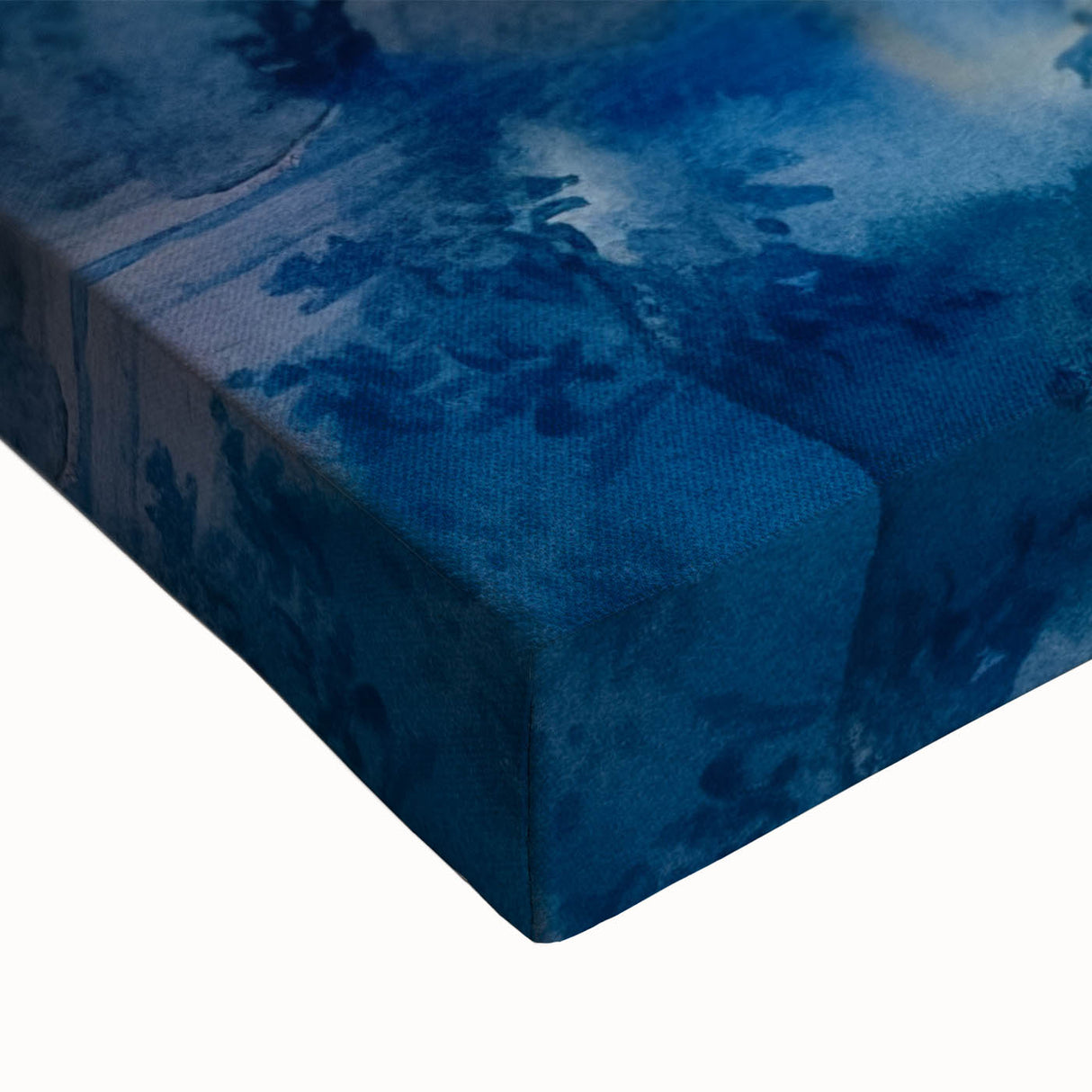 Close-up of a vibrant stretched canvas wall art piece showcasing a serene waterfall surrounded by lush greenery, perfect for home decor and nature lovers.