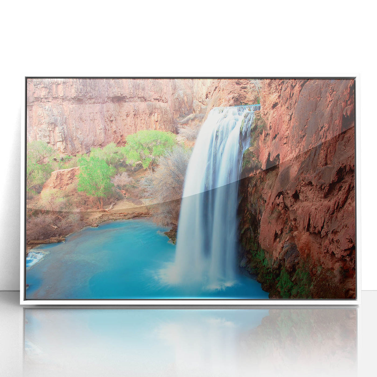 Framed acrylic wall art featuring a serene waterfall landscape design, showcasing vibrant blue and green hues, ideal for enhancing home decor with a nature-inspired theme.