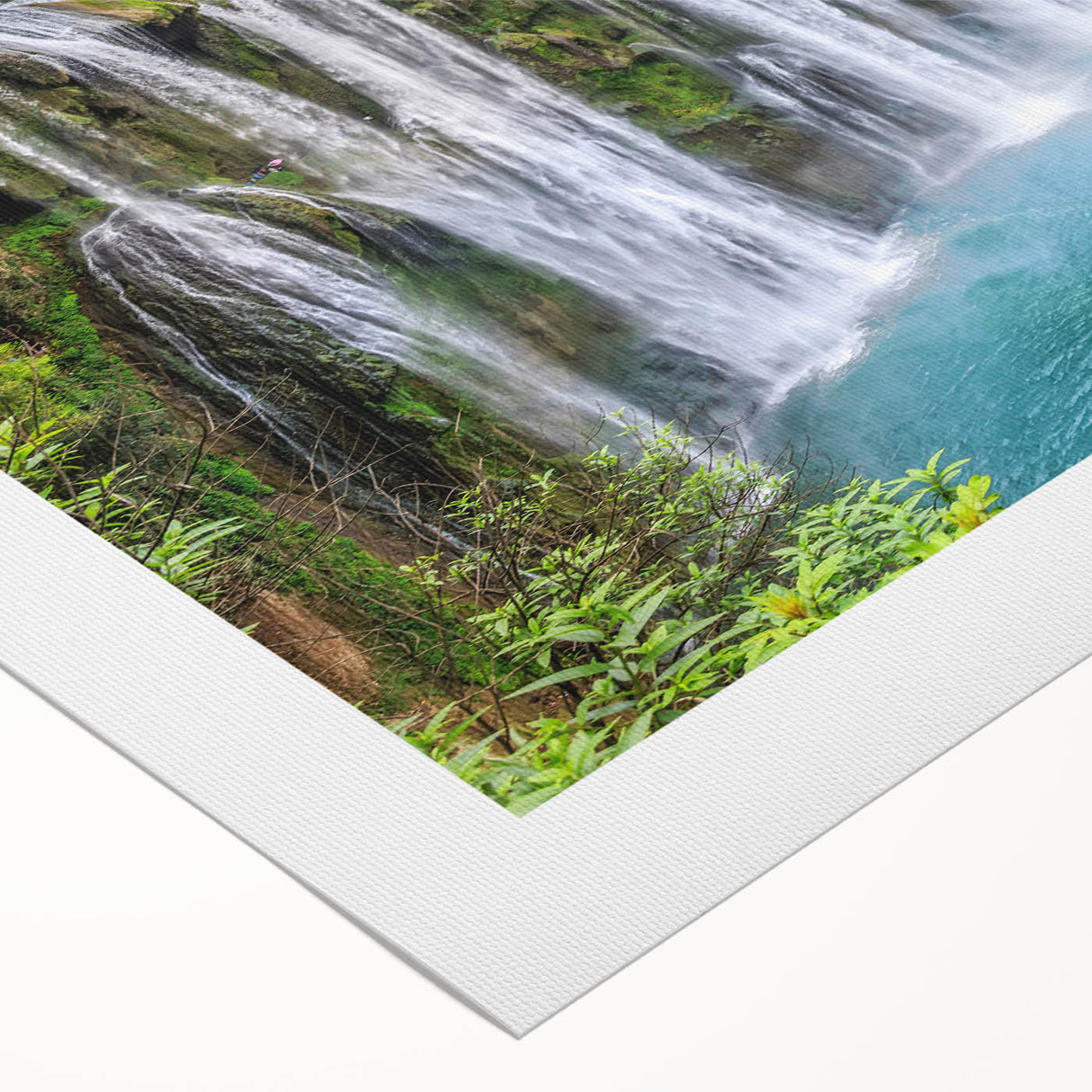 Stunning rolled canvas wall art showcasing a vibrant waterfall landscape, featuring lush greenery and cascading water, ideal for nature-themed decor.