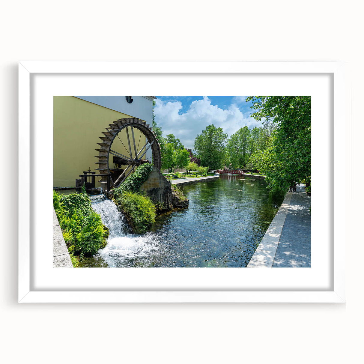 Framed wall art showcasing a serene landscape of watermills, featuring a white mat and sleek design, perfect for home decor and enhancing interior aesthetics.