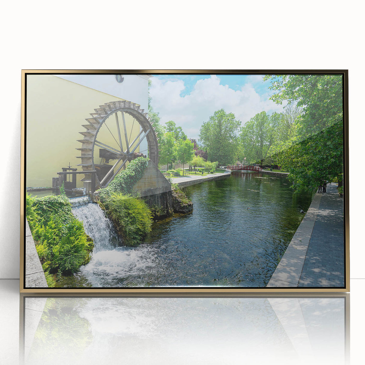 Framed wall art showcasing a serene landscape of watermills, featuring rich gold accents and a sleek acrylic front, perfect for enhancing home decor.
