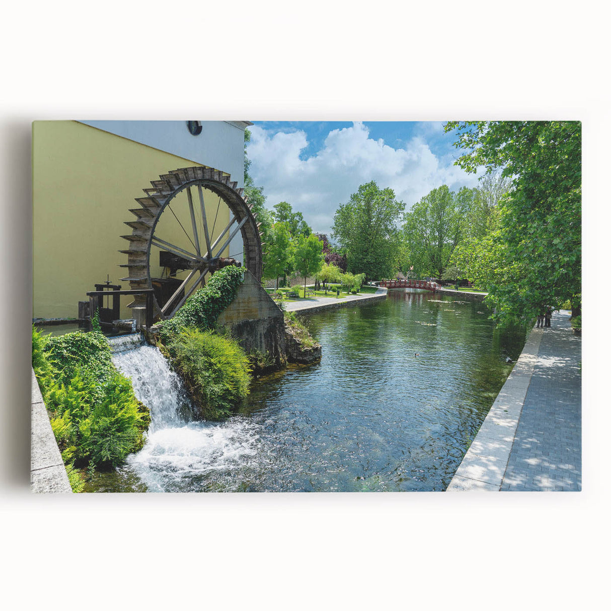 Stretched canvas wall art showcasing a serene watermill landscape design, featuring vibrant colors and intricate details, perfect for enhancing home decor.