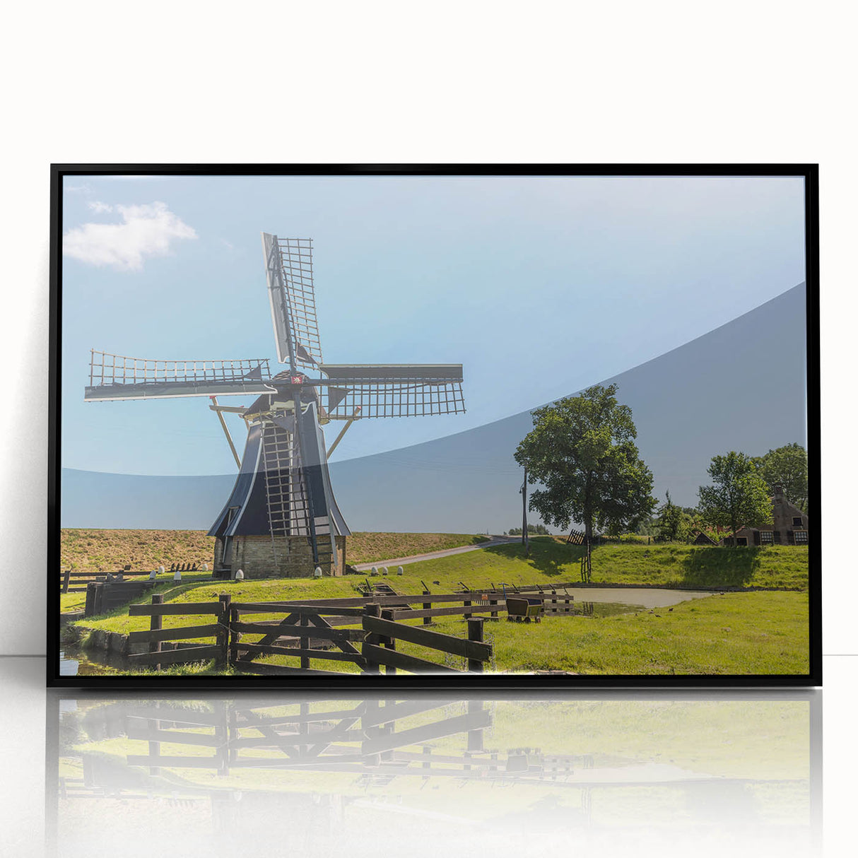 Framed acrylic wall art showcasing a landscape with windmills, featuring a sleek black frame and vibrant colors, perfect for home decor enhancement.