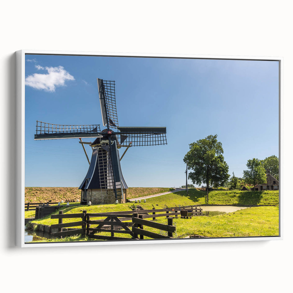Framed canvas wall art featuring a serene landscape with windmills, showcasing soft pastel colors and a tranquil atmosphere, perfect for home decor.