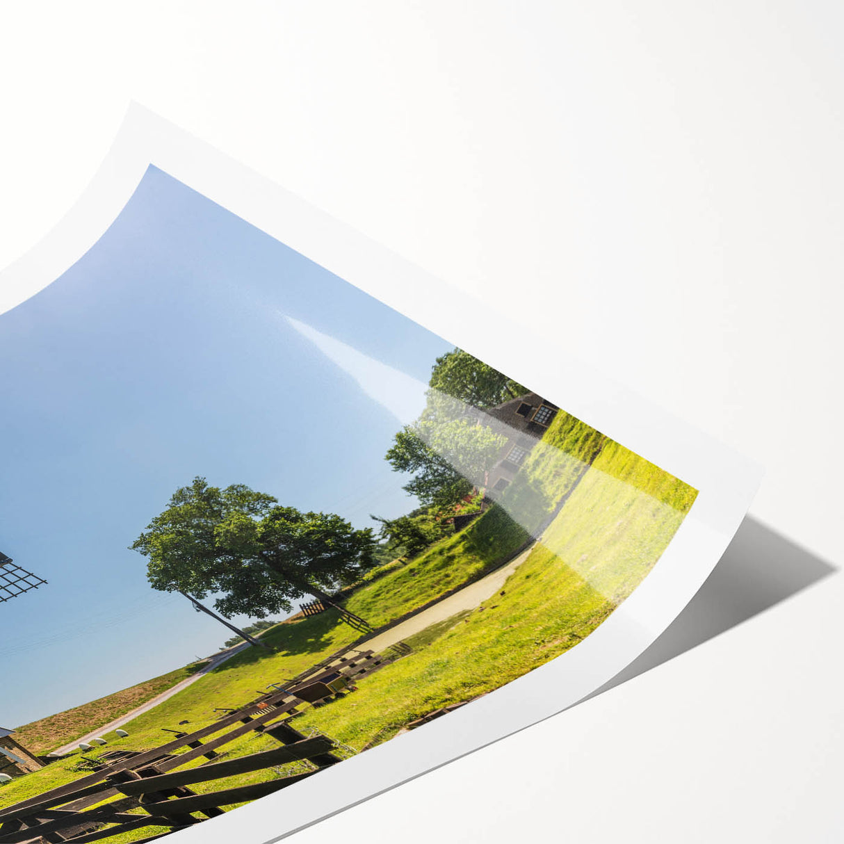 Vibrant landscape wall art print featuring iconic windmills amidst rolling hills, showcasing rich colors and intricate details, perfect for home decor.