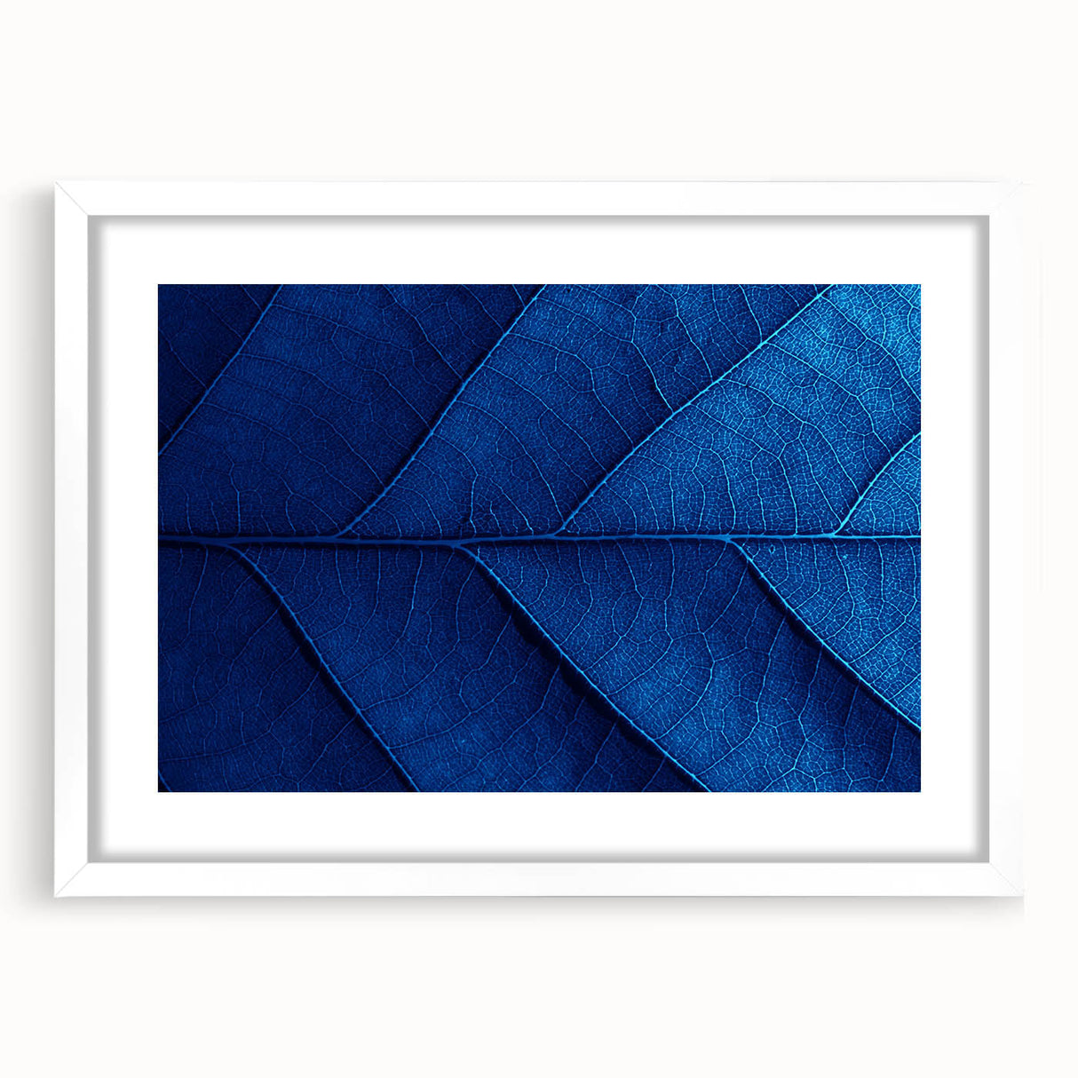 Abstract art print featuring vibrant floral patterns in a white frame, ideal for dining room decor.