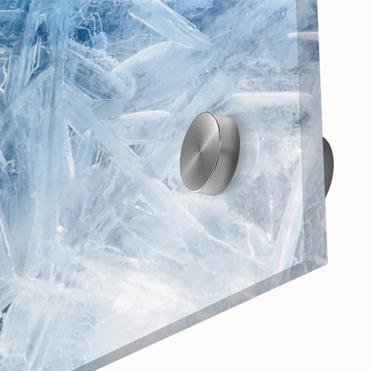 Close-up of frost design in cool blue and white tones on acrylic glass, suitable as mid-century modernist dining room art.