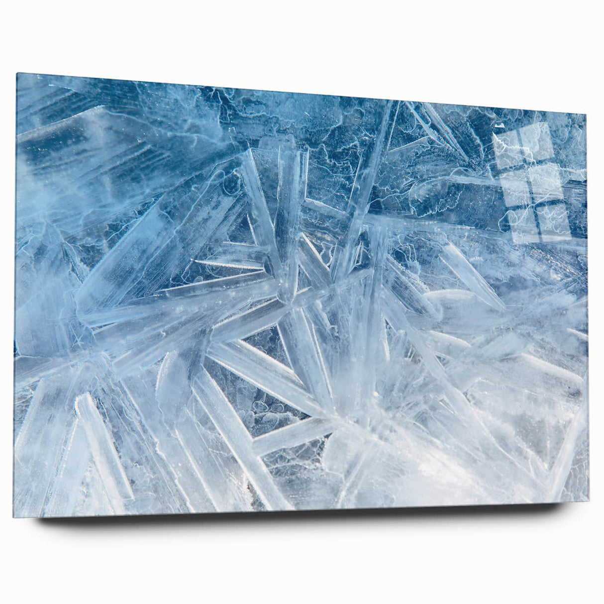 Close-up of frost patterns in blue and white tones on acrylic glass, suitable for modern art wall decor.