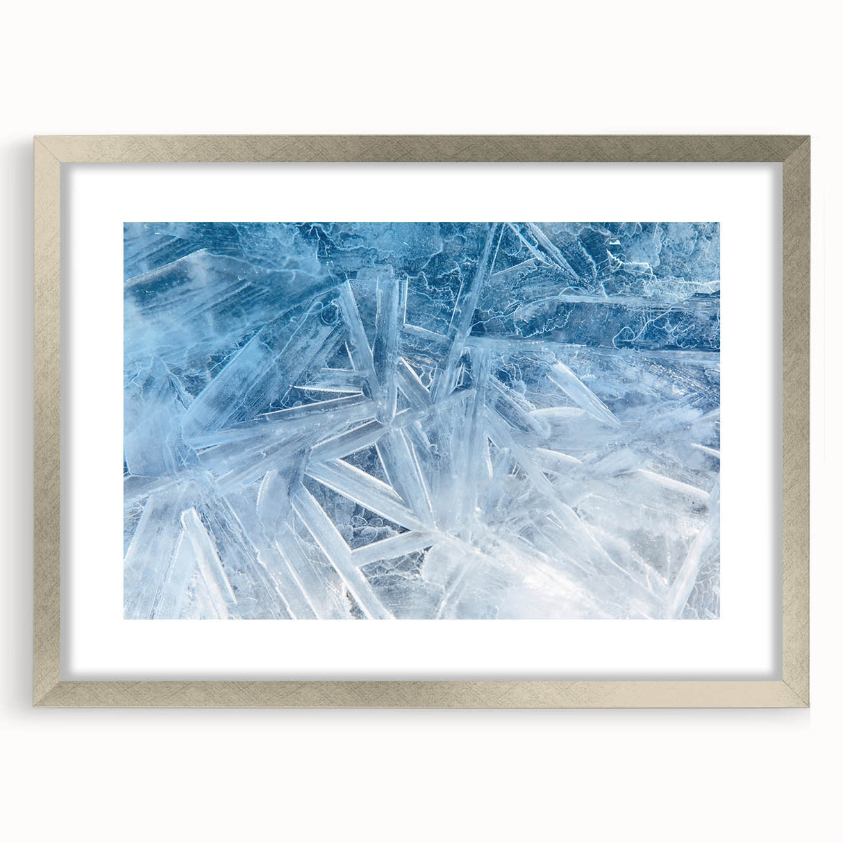 Abstract art print of frost patterns in muted silver and gray tones on a framed canvas, ideal for dining room decor.