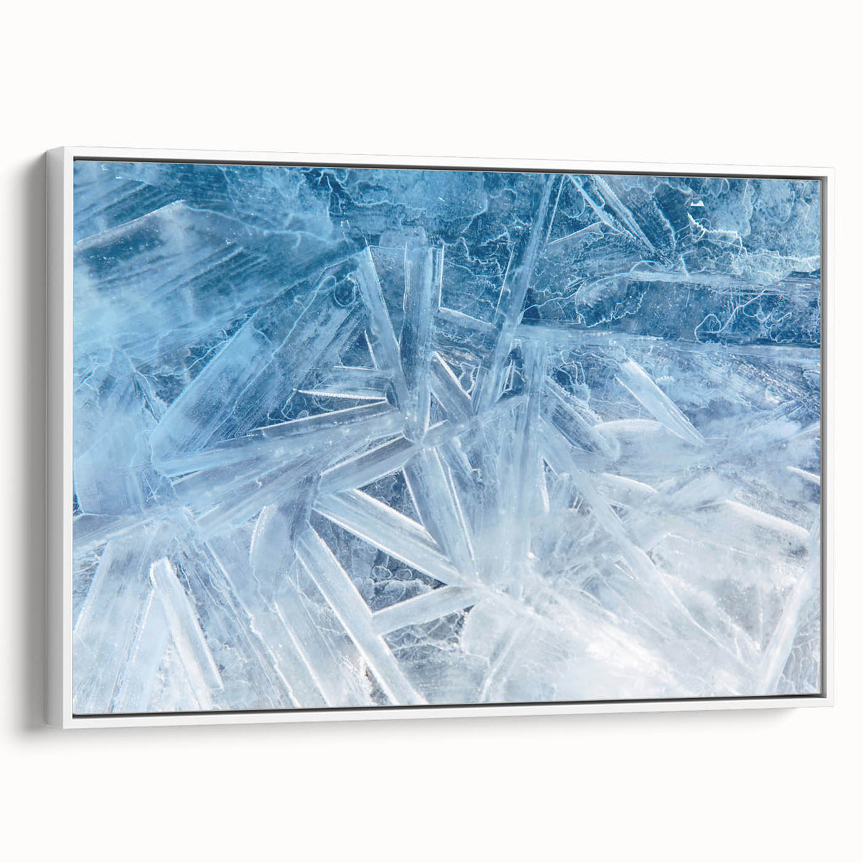 Framed canvas depicting a close-up of frost patterns in black and white, suitable as wall art for bedrooms.