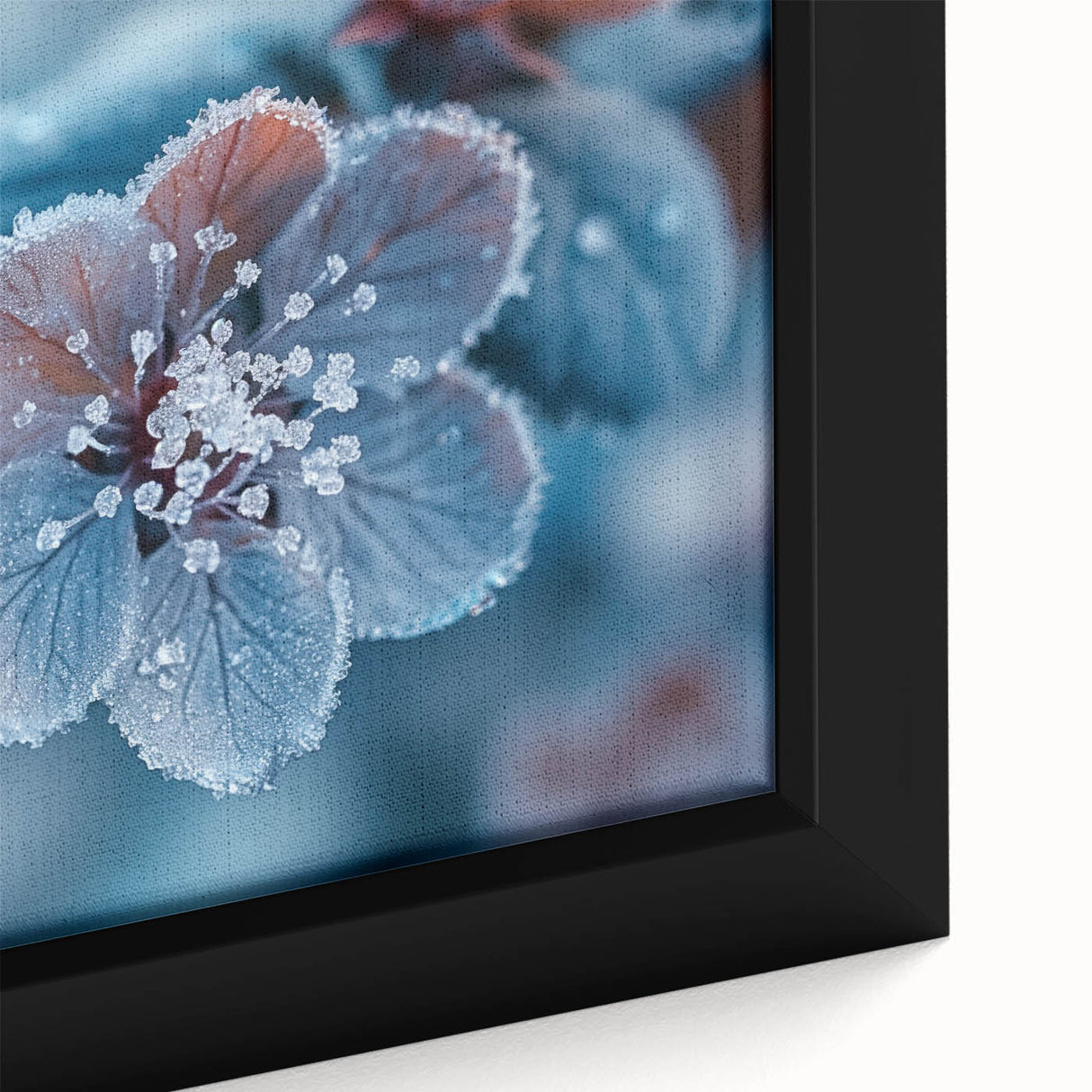 Close-up of black wall art featuring a textured frost design in vibrant colors on a framed canvas.