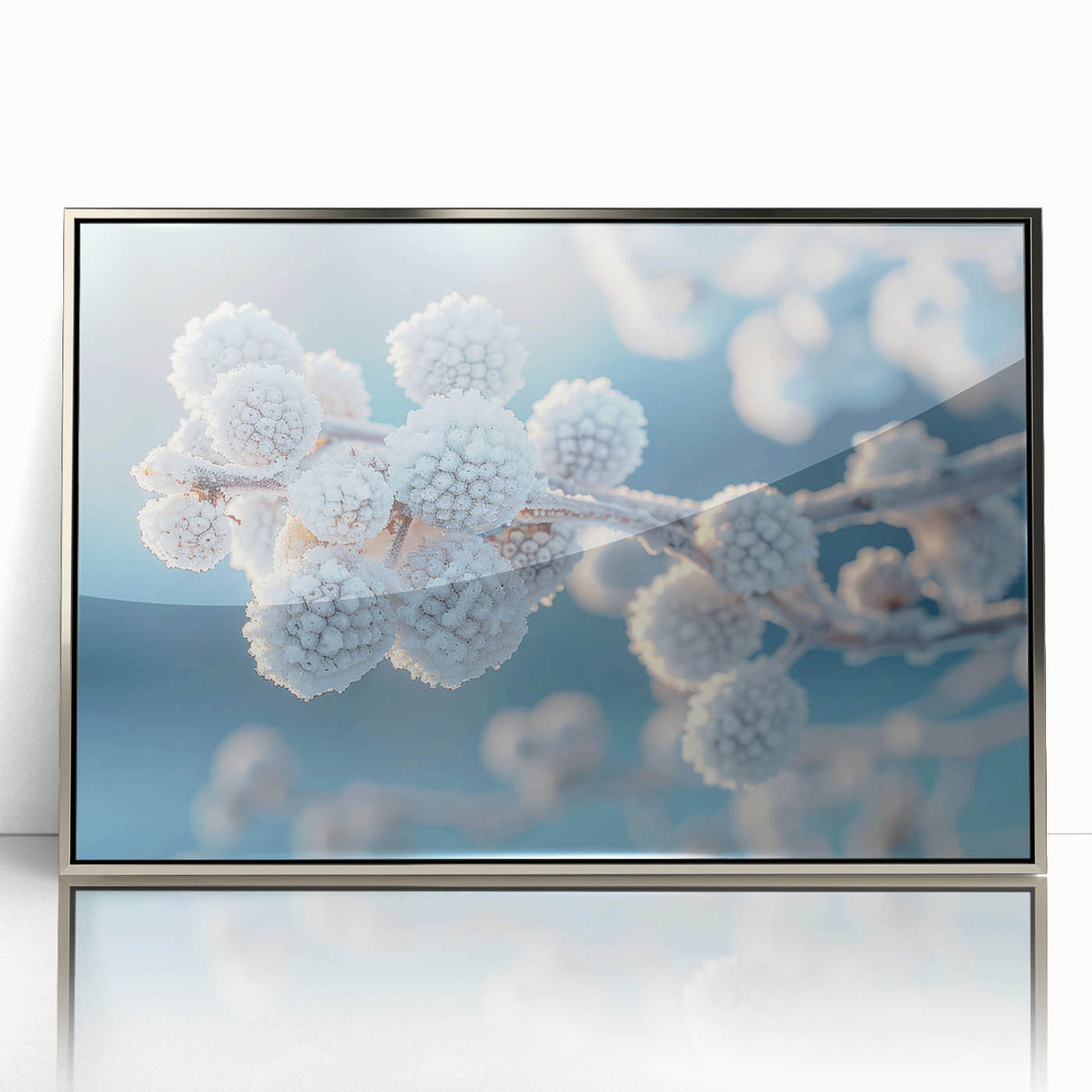 Art deco poster featuring a close-up of frost patterns in silver and blue tones on framed acrylic.