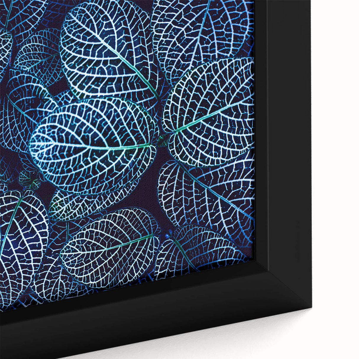 Close-up of textured black wall art featuring colorful leaves on a large framed canvas, suitable for living room decor.