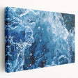 Close-up image of water ripples on a stretched canvas, featuring blue and gray tones, ideal for kitchen wall art.