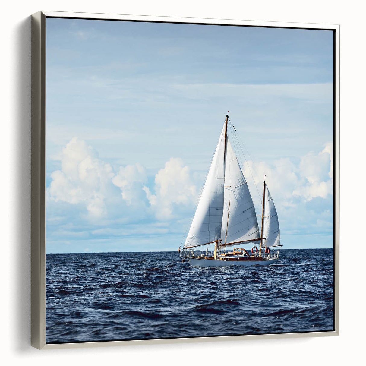 Vintage poster art of a colorful sailboat on black framed canvas, ideal for large living room walls.