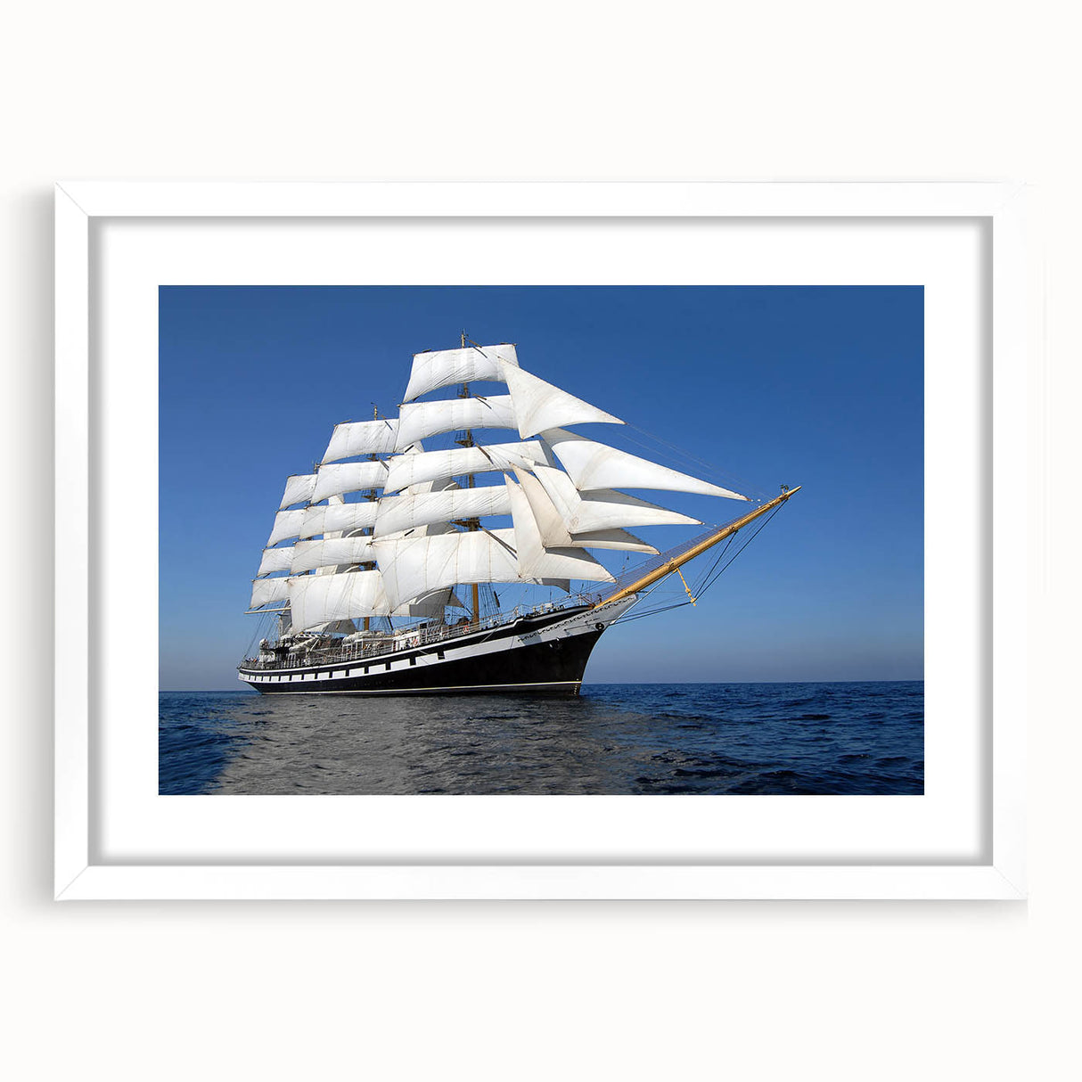 Abstract art print of a stylized ship in muted gray and blue tones on white framed canvas.
