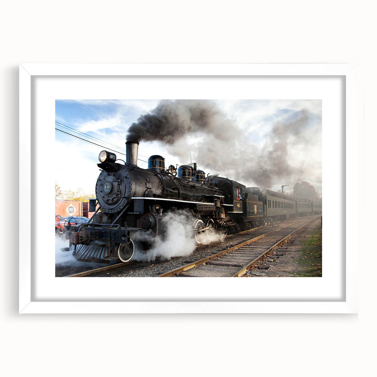 Abstract art print of a train in muted gray and blue tones on a white framed canvas, suitable for dining room decor.
