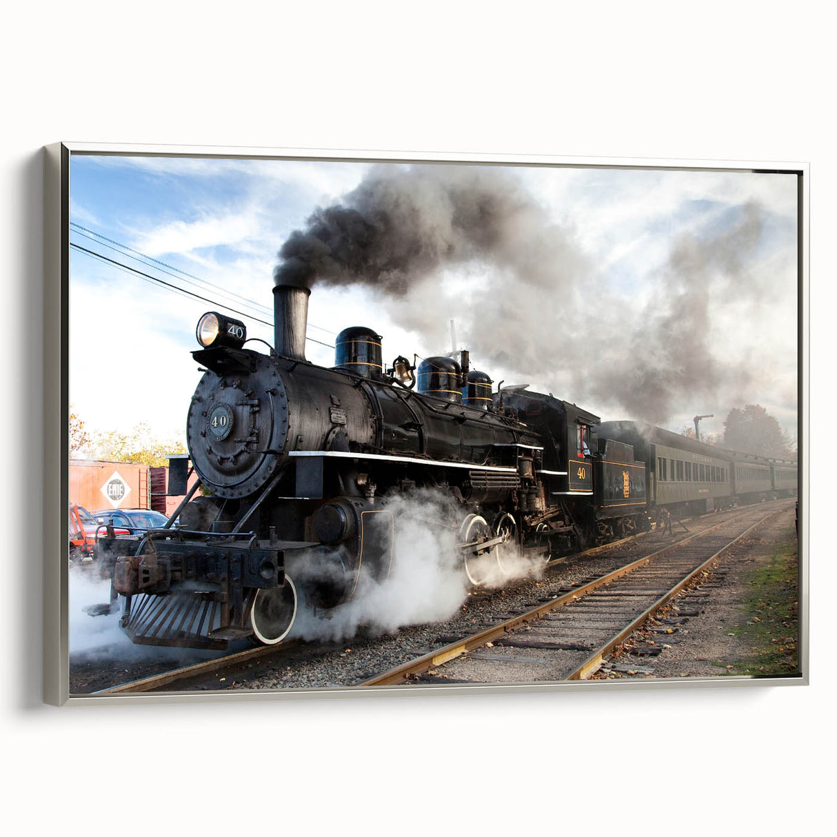 Framed canvas of a vintage train in motion, rendered in colorful art style on a black background.