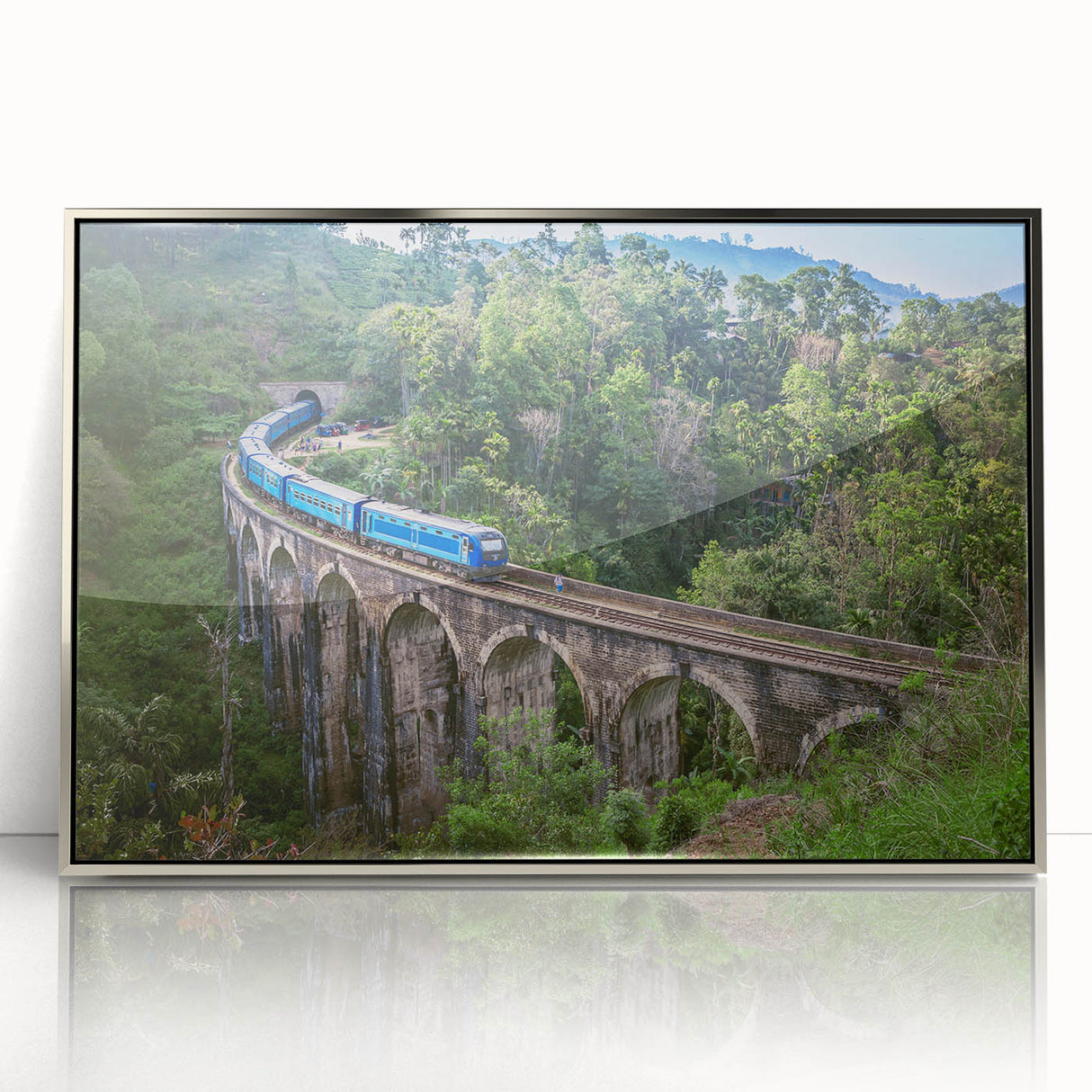 Mid-century modernist train art in acrylic, with silver frame, featuring muted earth tones, ideal for nursery wall decor.