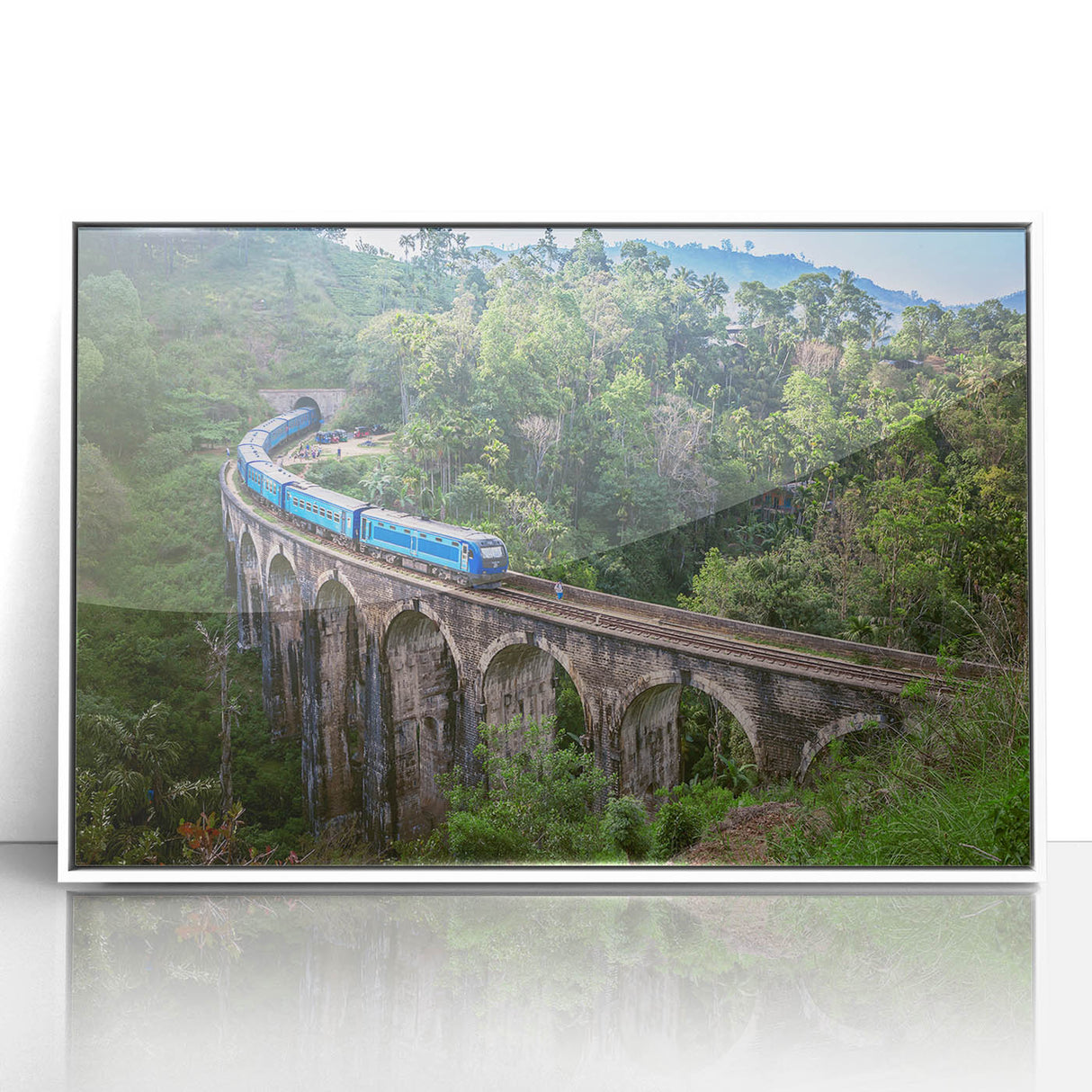 Art deco style train illustration in bold colors on a white acrylic framed poster, ideal for nursery wall decor.