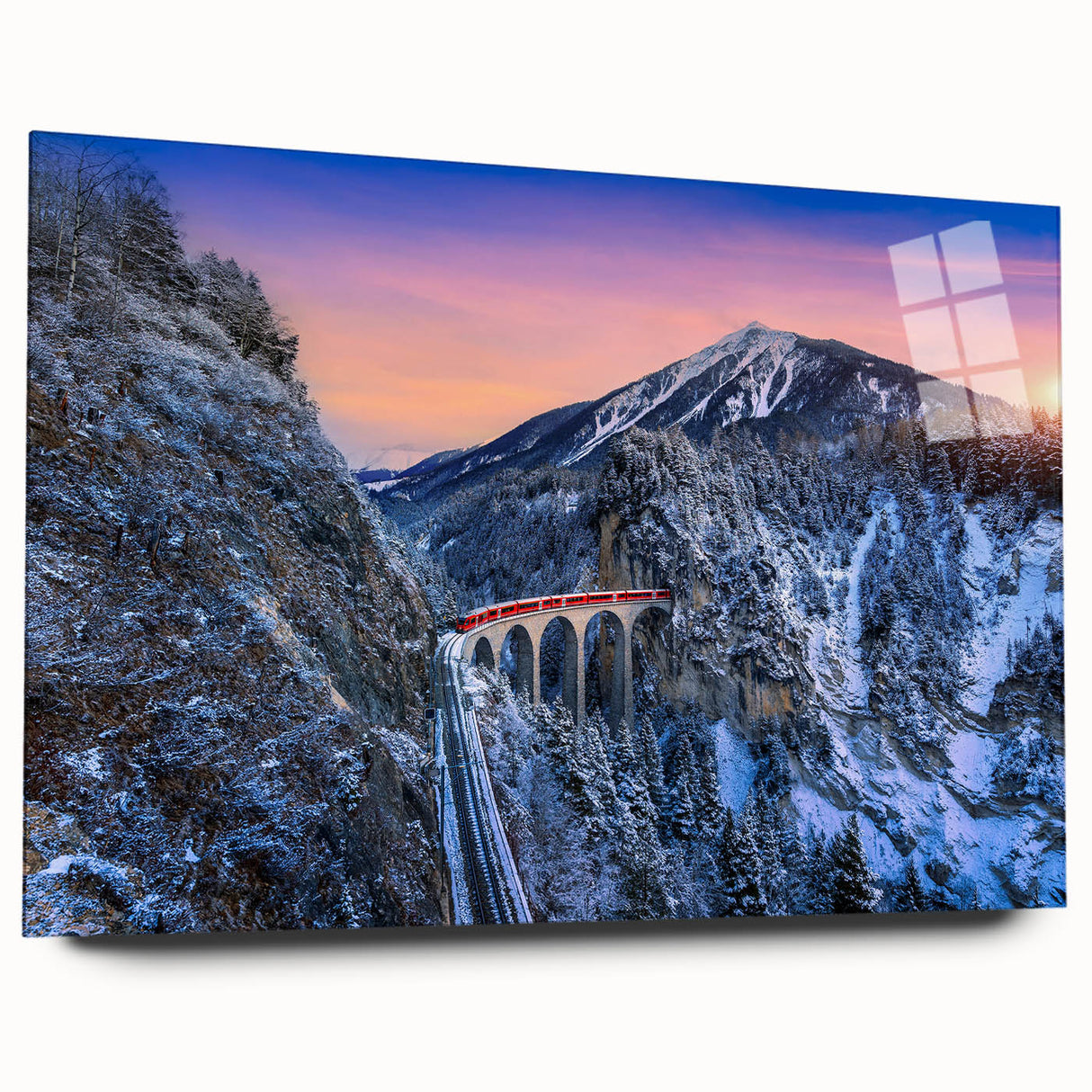 Side view of a large abstract train print in vibrant blues and oranges on acrylic glass.