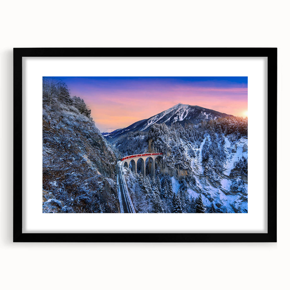 Extra large, colorful abstract art print of a stylized train, in a black frame with mat, ideal for living room decor.