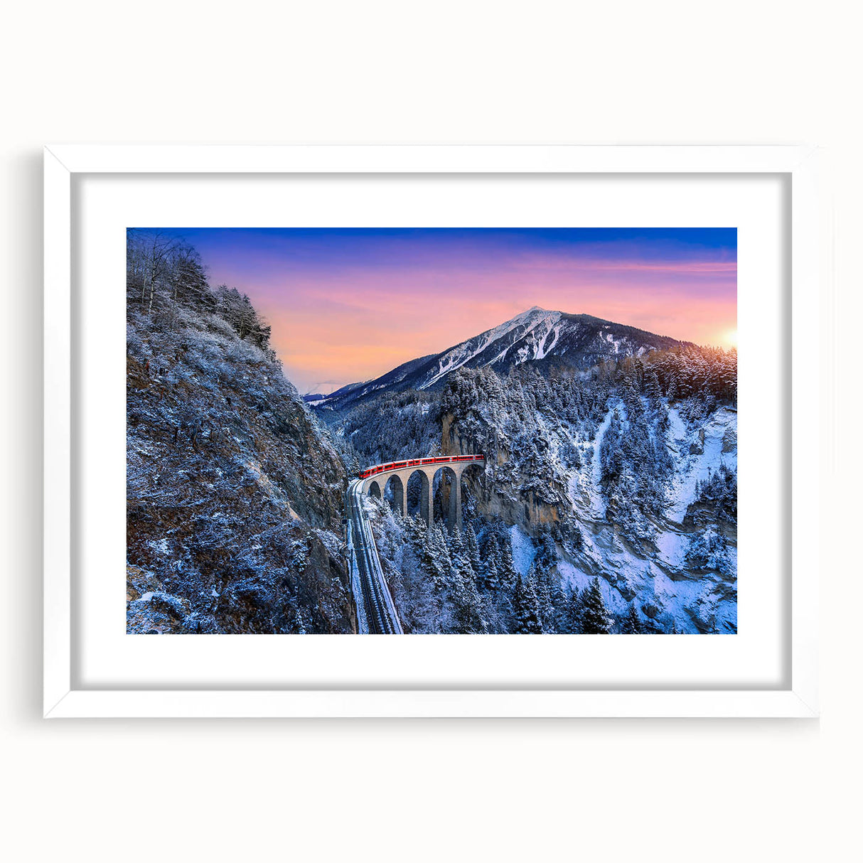 Abstract art print of a stylized train in muted gray and blue tones, framed with a white mat.