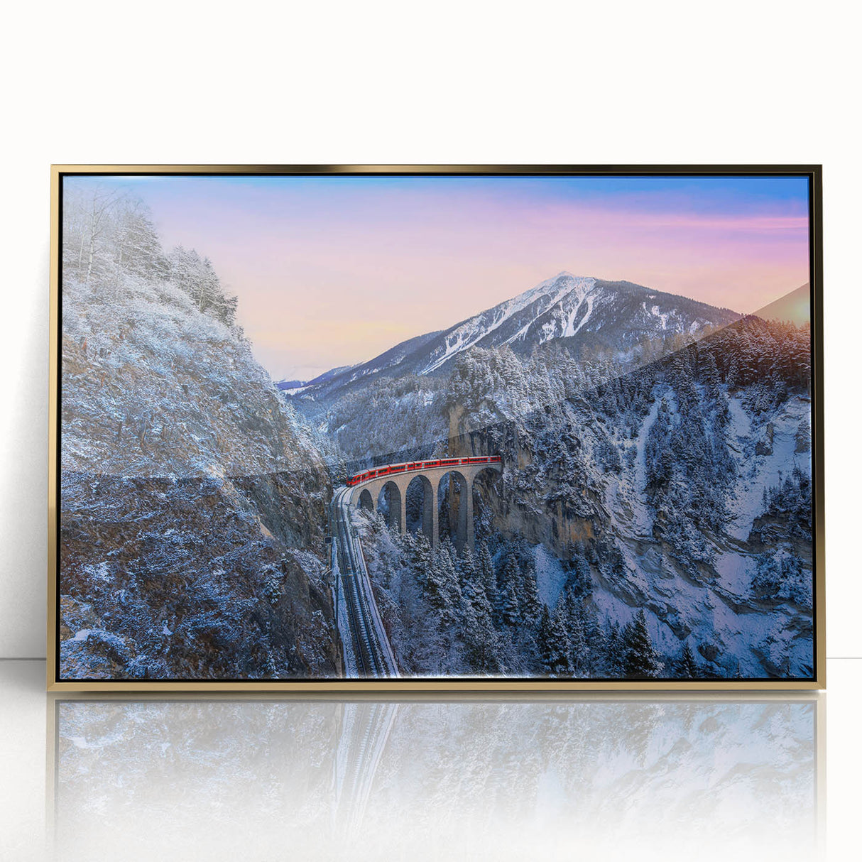 Mid-century modernist train illustration in muted gold and black tones, acrylic print framed in gold.