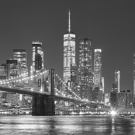 Urban city skyline wall art of New York in black and white, featuring Brooklyn Bridge and lit skyscrapers for modern metropolitan decor