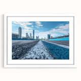 Abstract art print featuring swirling blue and gray tones on a framed canvas, suitable for bedroom or dining room decor.