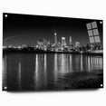 Large abstract wall art featuring swirling blue and gray tones on a canvas, suitable for bedroom or dining room decor.