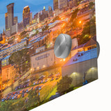 Large abstract wall art in vibrant orange and blue tones on canvas.