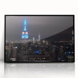 Large abstract wall art featuring swirling blue and gray tones on canvas, ideal for modern living room decor.