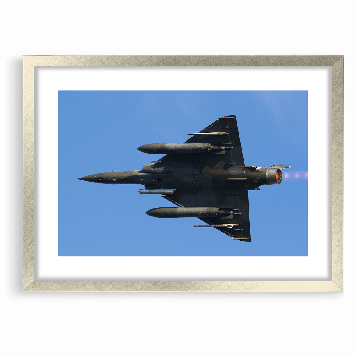 Modern Aviation Art: Fighter Jet in Flight Against Blue Sky Canvas Print