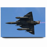 Modern Aviation Art: Fighter Jet in Flight Against Blue Sky Canvas Print