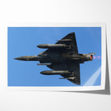 Modern Aviation Art: Fighter Jet in Flight Against Blue Sky Canvas Print