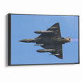 Modern Aviation Art: Fighter Jet in Flight Against Blue Sky Canvas Print